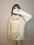 Cream Legally Friends Chaps My Ass hoodie modeled with front graphic and sleeve detail